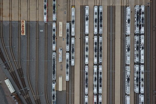 Aerial view of light rail trains parked in parallel rows at a maintenance depot in Englewood, Colorado, United States.