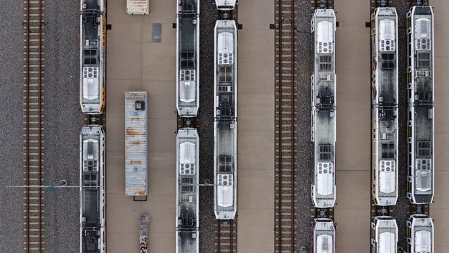 Aerial view of light rail trains parked in parallel on tracks at a maintenance facility in Englewood, Colorado, United States.