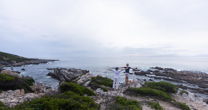 stormy late afternoon light on rocky coastline of DeKelders, South Africa