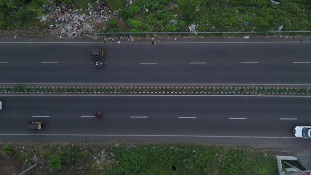 Top aerial view of highway traffic moving along a major road in Bharuch, Gujarat, India