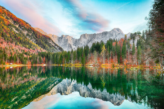 Stunning view of Fusine lake with Mangart peak on background.