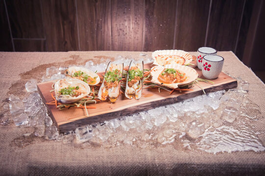Assorted shellfish platter with aromatic toppings