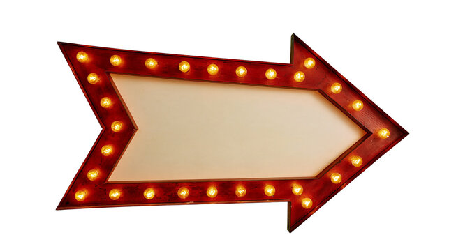 Red arrow shaped marquee sign with glowing warm light bulbs