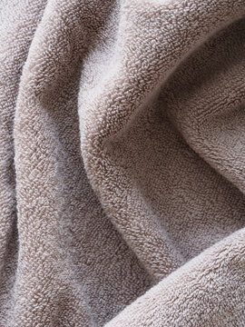 Brown Terry Towel with Layered Curved Folds and Soft Texture