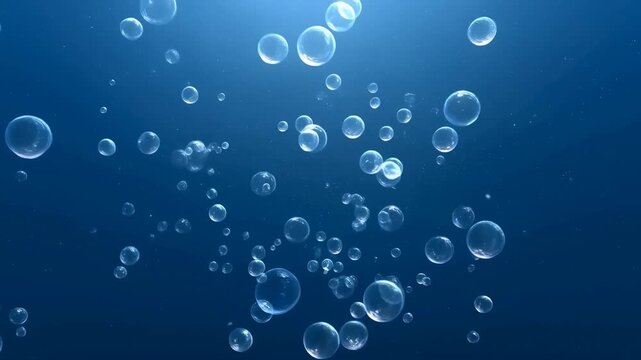 Underwater bubbles rise through deep blue water in an atmospheric aquatic background. Water product advertising, spa and wellness media, and marine science presentation.