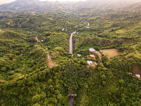 Aerial view of the Tunel Puerto Plata - Santiago entrance surrounded by lush green mountains and dense tropical forest in Altamira, Puerto Plata, Dominican Republic.