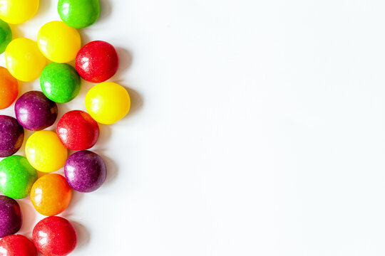 sweets and sugar candies on white background top view