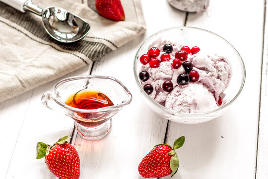 organic homemade ice cream in glass bowl on wooden background
