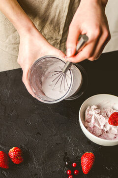 organic ice cream homemade process on dark background with hands