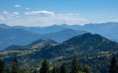 Obraz premium Scenic View of Layered Mountain Ridges Under Clear Sky