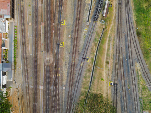 Aerial view of Stasiun Kejaksan railway tracks with multiple parallel lines, switches, and gravel ballast in Cirebon, West Java, Indonesia.