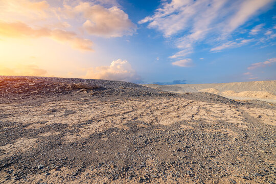 Scenic sunset over a desolate Gobi Desert landscape in Xinjiang, China