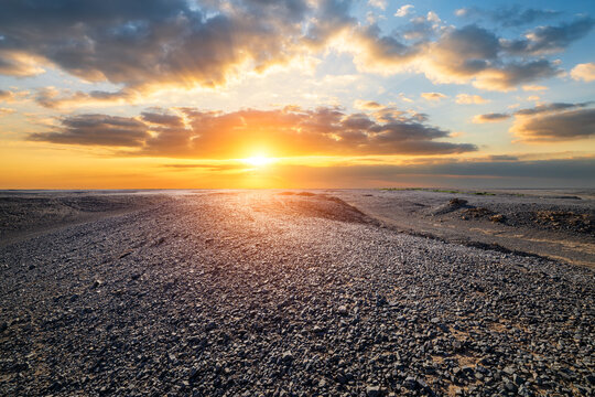 Sunset over the desolate Gobi Desert landscape in Xinjiang, China