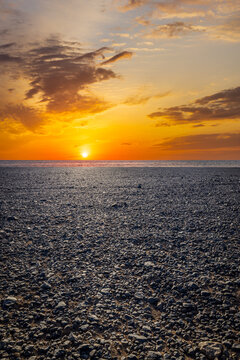 Sunset over the desolate Gobi Desert landscape in Xinjiang, China