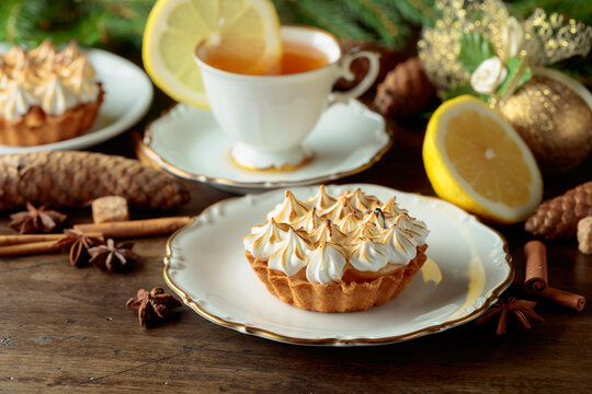 Meringue lemon tart and cup of tea.