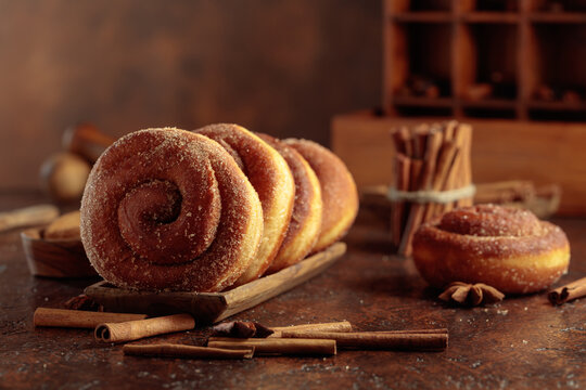 Swedish cinnamon rolls on a brown background.
