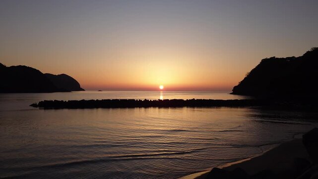 Golden sunset reflecting on the sea at Nonami Beach Park, Shimane Peninsula, Japan