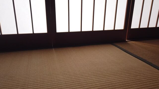 Slow Panning Close Up of Traditional Tatami Room with Shoji Screens and Sunlight in Japan