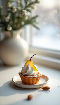 Dessert tart with whipped cream and pear slice on a table by window  
