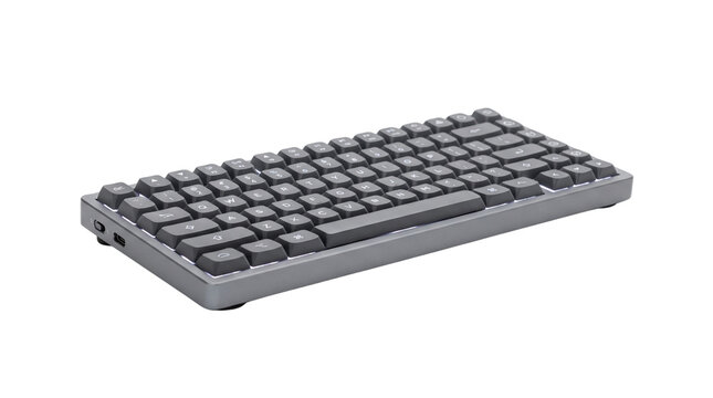 Mechanical wireless keyboard, compact grey computer peripheral, sleek desktop hardware for office and gaming setups