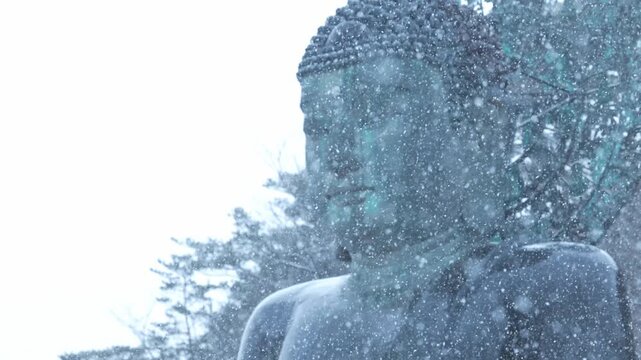 Tongil Daebul, The Great Unification Buddha Statue, Stands During Snowfall Near Sokcho In South Korea. Close-up Shot