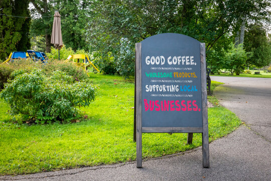 Chalkboard Promoting Local Businesses and GOOD COFFEE.