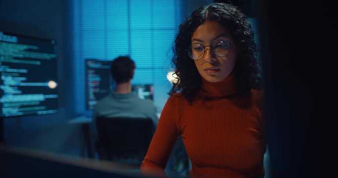 Group Adult male, female freelance typing write prompt AI bot IT app smart program nomad, video game, terminal with coding language, designer, big data center on desktop computer in office at night.
