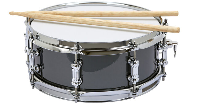 Dark grey metallic snare drum with two wooden drumsticks resting on top