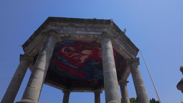 Historic kiosk in Ciudad Guzman main park, Zapotlan el Grande, Jalisco, Mexico, backward reveal shot