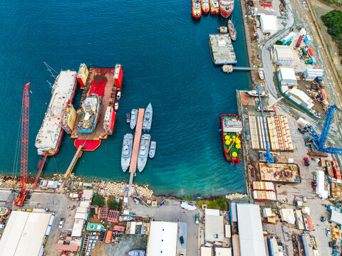 Aerial view of Limassol Marina featuring various ships, boats, industrial cranes, and shipyard infrastructure in Lemesos, Lemesos, Cyprus.