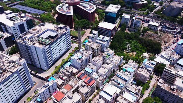 Maximus building 2A and 2B buildings with signal tower, residential buildings and TCS Deccan Park at hitec city, madhapur, hyderabad, telangana, india. day time, crane shot, drone shot, 4k.