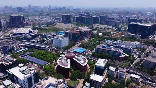 High angle view of TCS Deccan Park with Cyber Pearl, Cyber Gateway, Lemon Tree Hotel and Deloitte Towers at hitec city, madhapur, hyderabad, telangana, india. day time, push back shot, drone shot, 4k.