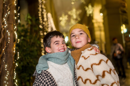Happy children embracing during festive christmas celebration