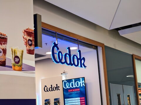 Prague,Czech Republic-April 23 2025:Cedok travel agency logo above a shopping center branch