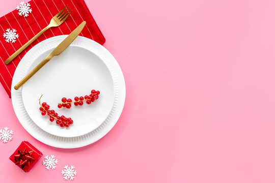 Festive Christmas table setting with red colored decoration. Top view