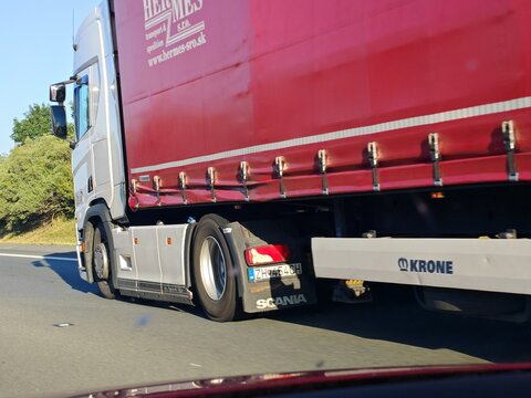 Prague,Czech Republic-August 23 2026:Scania truck hauling a Krone semi-trailer