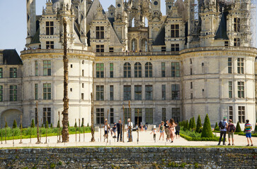 Architectural details of Château de Chambord, a historic Renaissance castle in Chambord, France, photographed on May 29, 2023. The image shows the ornate façade, dormer windows and distinctive double  © ola_pisarenko