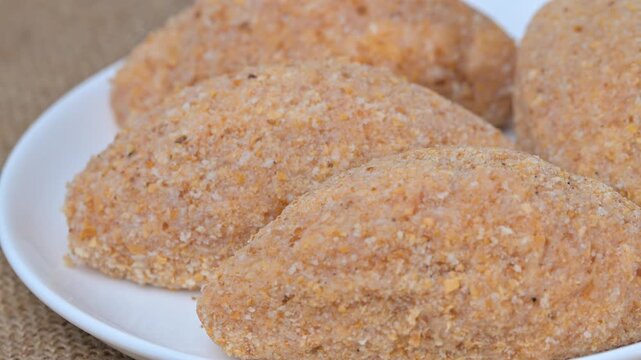 video of a breaded cordon bleu schnitzel filled with melted cheese
