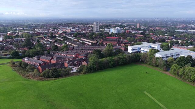 Aerial Video of Oldham Edge Playing Fields and Oldham Town Skyline in Greater Manchester. 