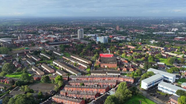 Aerial Video of Oldham Townscape Terraced Streets and Civic Centre Tower from Oldham Edge, Greater Manchester UK. 