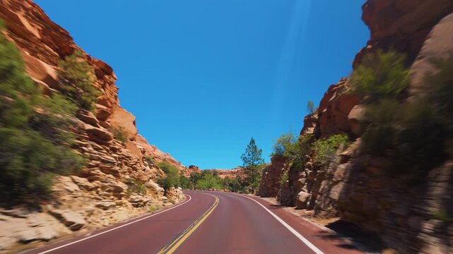 Zion National Park POV Drive Along Red Pavement and Sandstone Utah