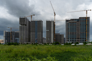 High rise buildings under construction in urban area © IbragimovN