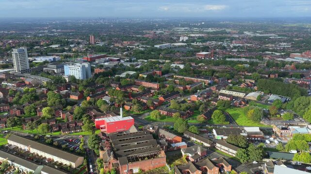 Aerial Video of Oldham Townscape Terraced Streets and Civic Centre Tower from Oldham Edge, Greater Manchester UK. 