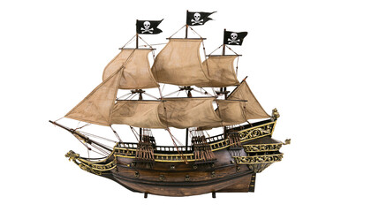 Obraz premium Detailed wooden pirate ship model with fabric sails and black skull flags