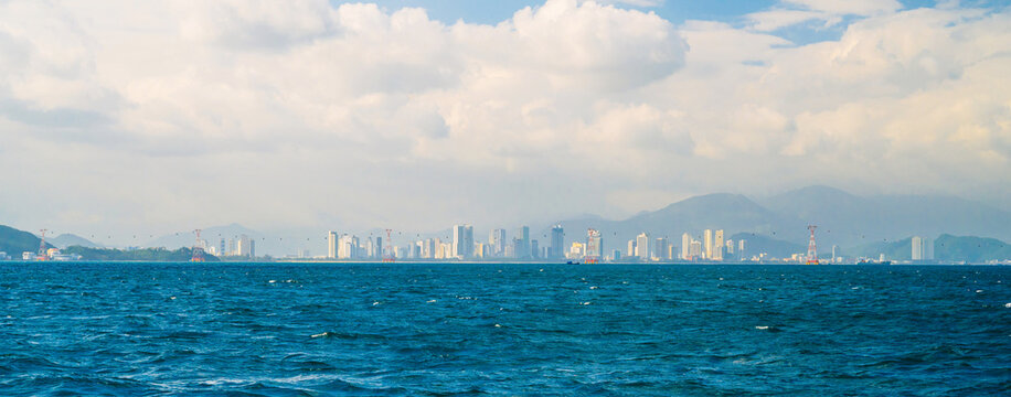 Panorama of city of Nha Trang in Vietnam. A panoramic landscape with a view of coastal city by sea in Asia