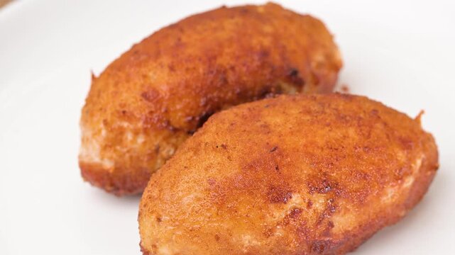 video of a breaded cordon bleu schnitzel filled with melted cheese