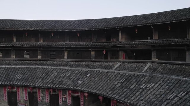 Circular Tiled Roofs and Wooden Galleries of a Traditional Tulou Building in Fujian, China