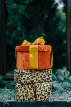 Christmas gifts in boxes by the door of a house, holiday season