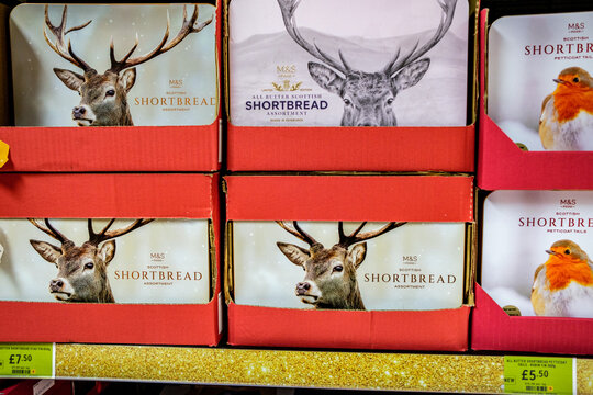 Supermarket Display Of Marks And Spencer All-Butter Scotish Shortbread Stag Tins And Petticoat Tails Robin Tins With Price Tags