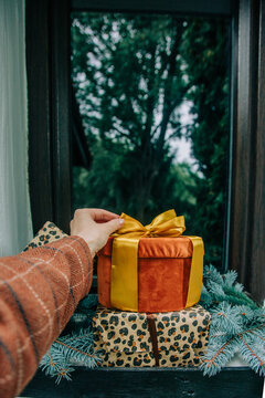 Christmas gifts in boxes by the door of a house, holiday season